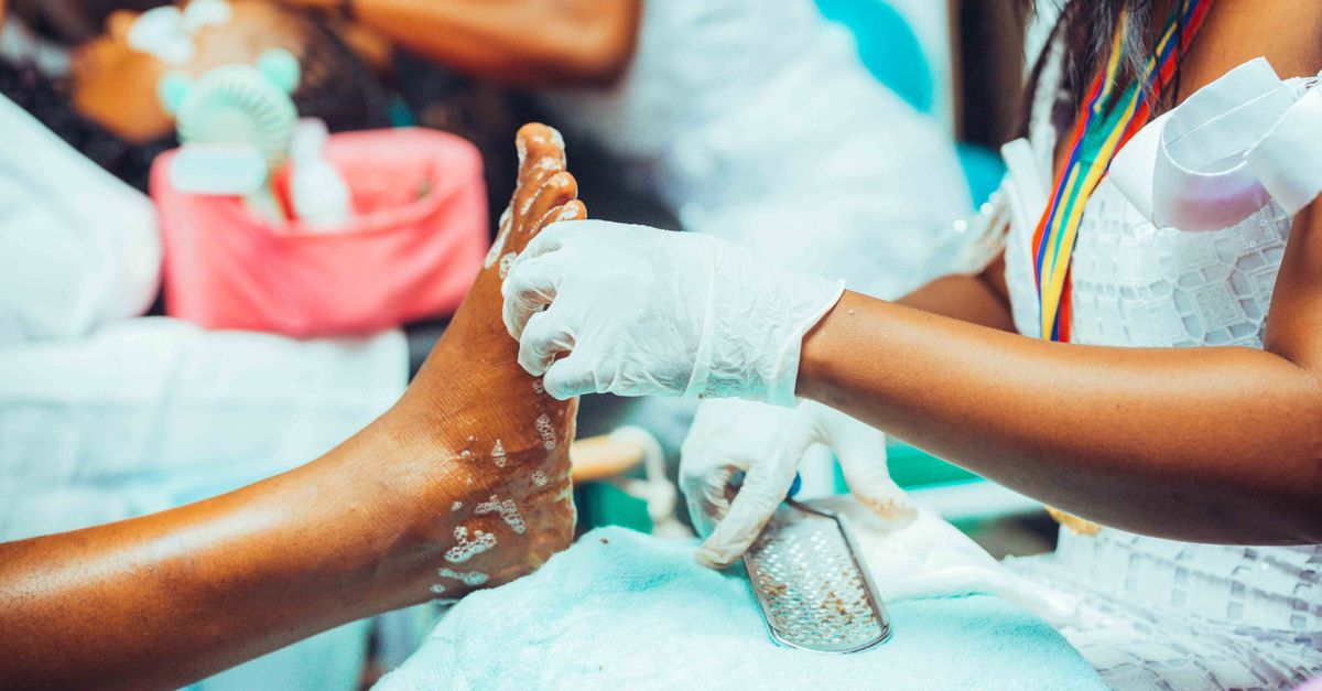 Close-up of a pedicure treatment being performed in a salon setting.