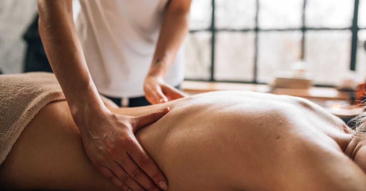 Experience relaxation with a full body massage in a serene indoor spa environment.