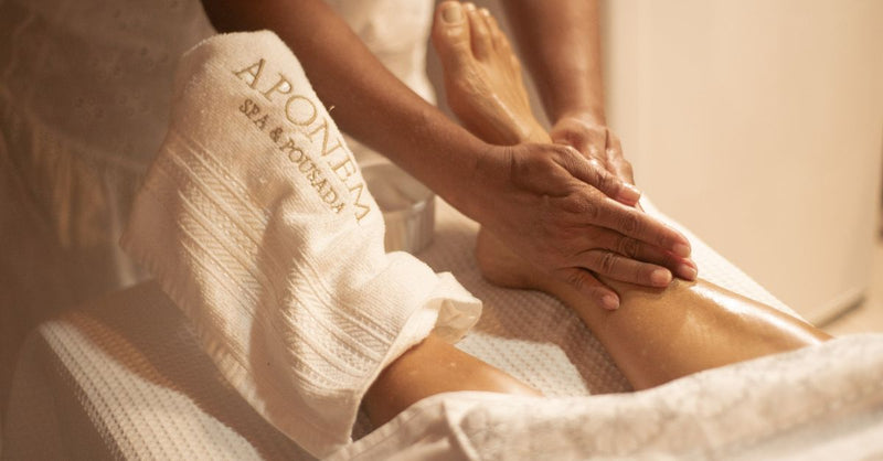 Close-up of a foot massage at Aponema Spa, emphasizing relaxation and wellness.