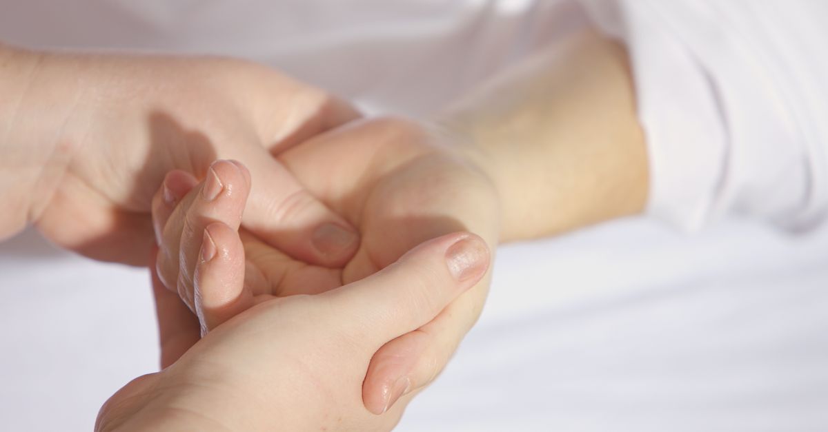 Relaxing hand massage session, close-up with gentle touch and care.